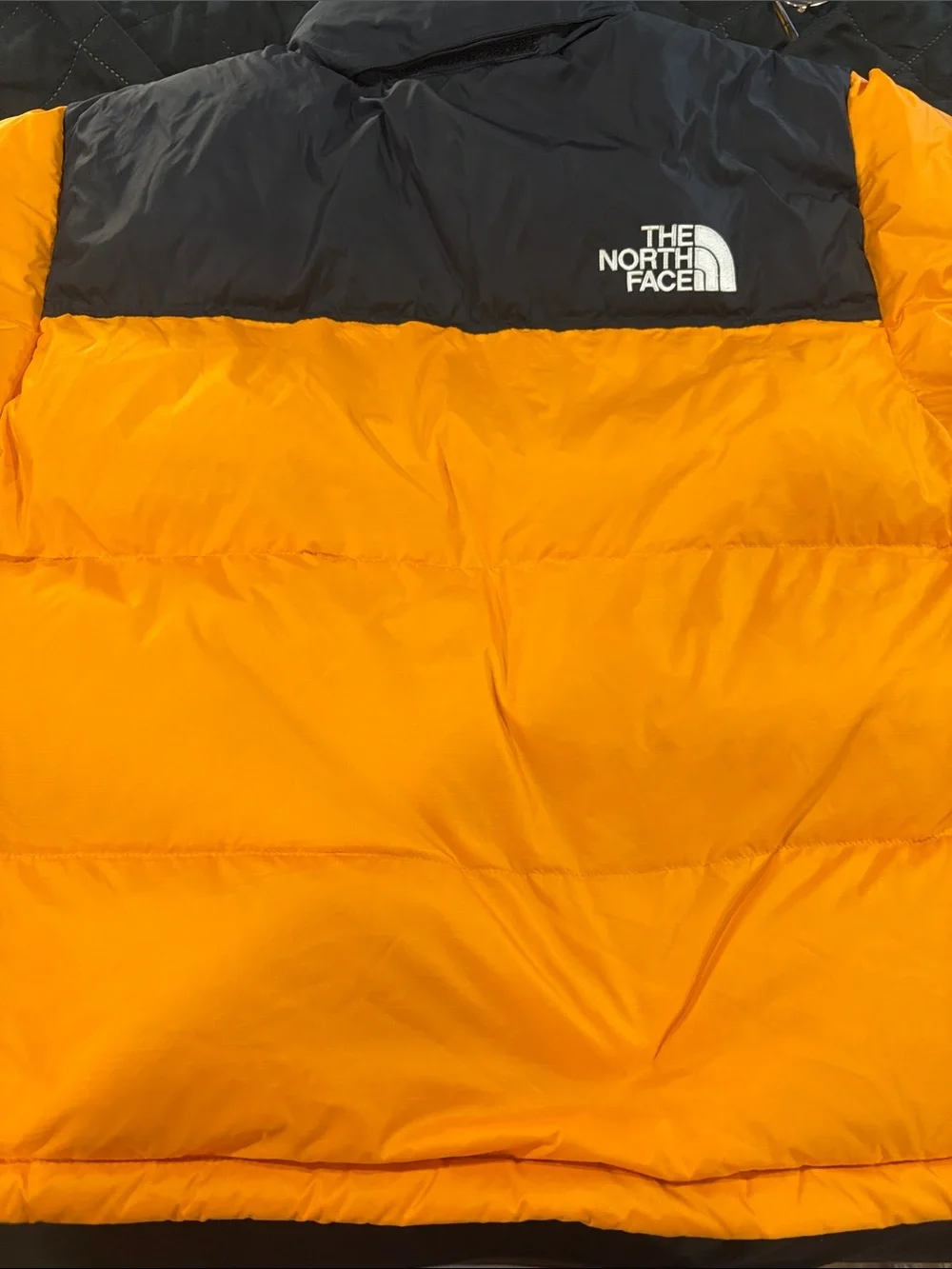 The North Face Men’s Orange and Black Puffer Jacket